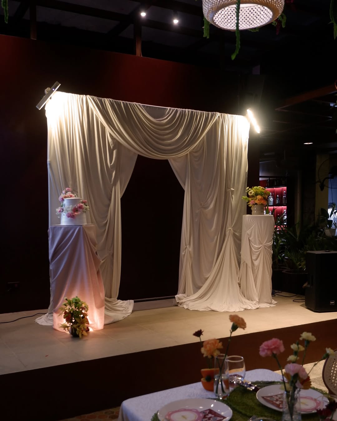 AMBAI stage with birthday cake setup